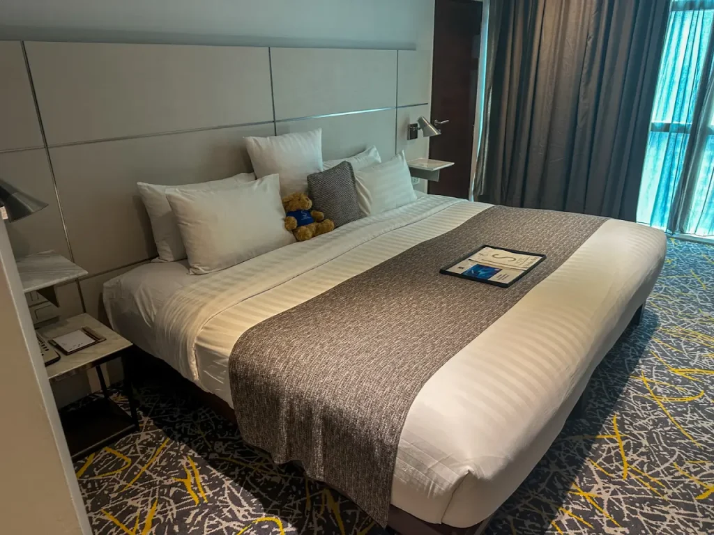 Deluxe Room at S31 Sukhumvit Hotel with a large bed