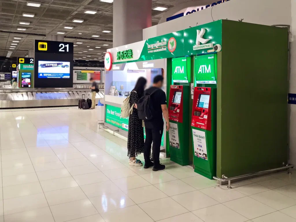 Kasikorn Bank green ATM machine at Bangkok Suvarnabhumi Airport baggage claim area